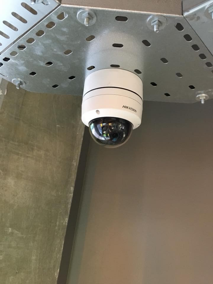 Dome camera installed above an entrance