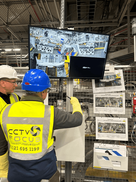 CCTV Focus engineer reviewing footage on site at an industrial warehouse